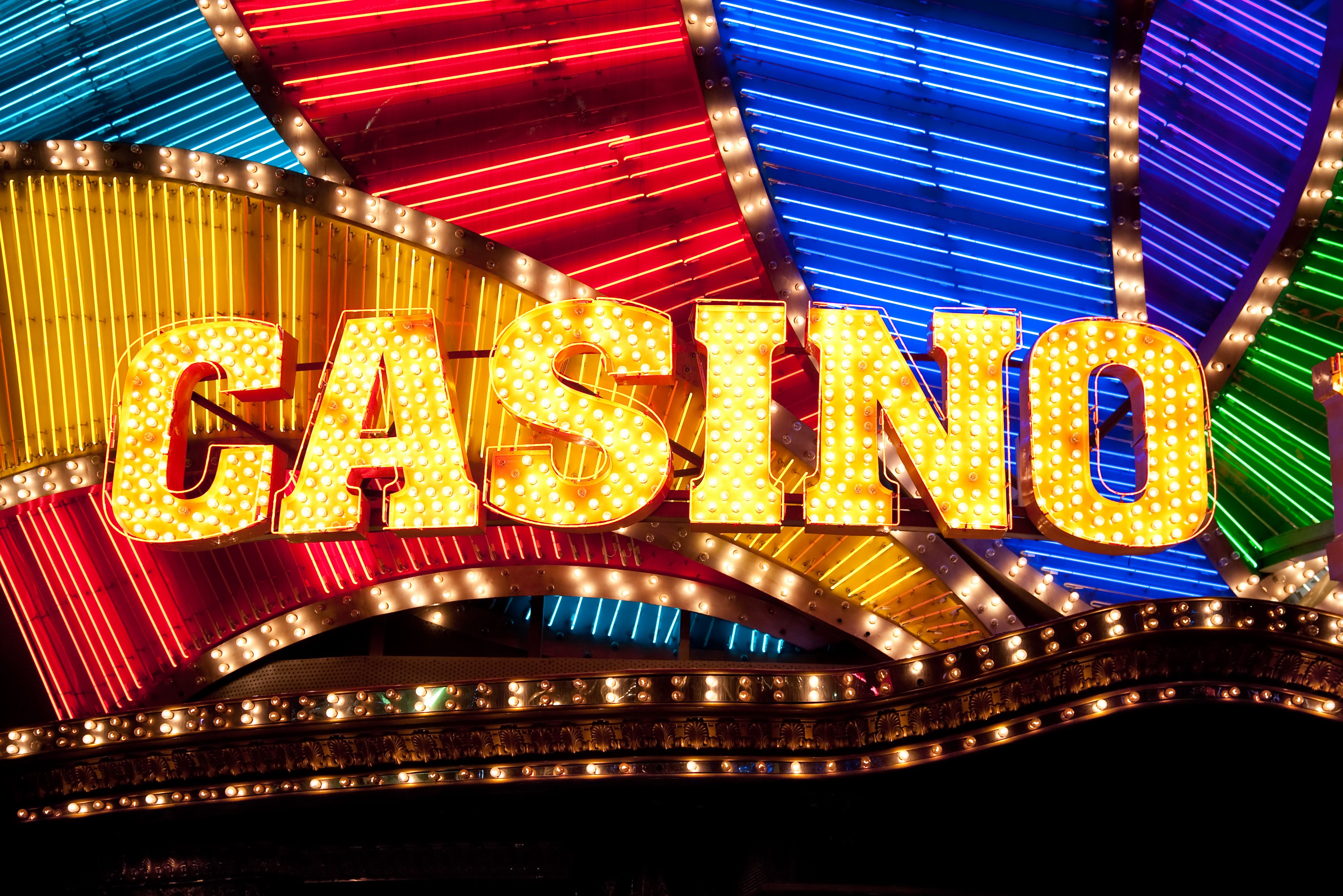 A vibrant graphic showcasing the Fun Of Vegas logo and a cascade of gold coins and Vegas icons.